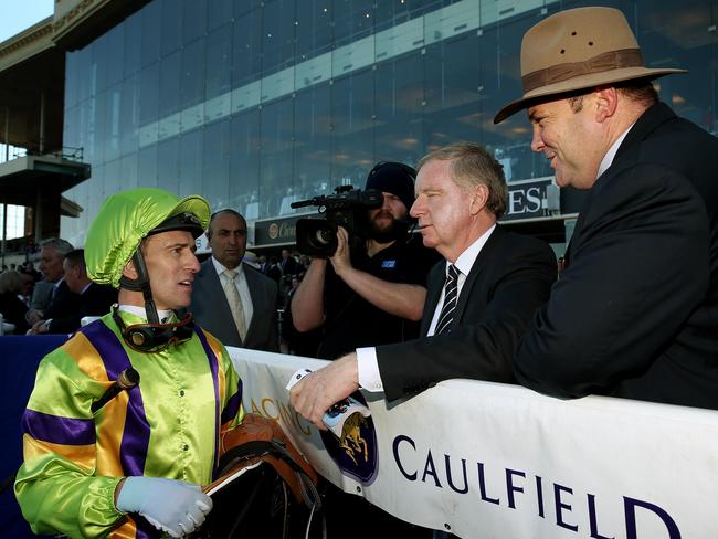 Memsie Stakes Day at Caulfield  ,  Race 5 - The Shark Stakes 1100m, Jockey Vlad Duric talks with trainer Peter Moody after there win with Flamberge. 30th August 2014. Picture : Colleen Petch.