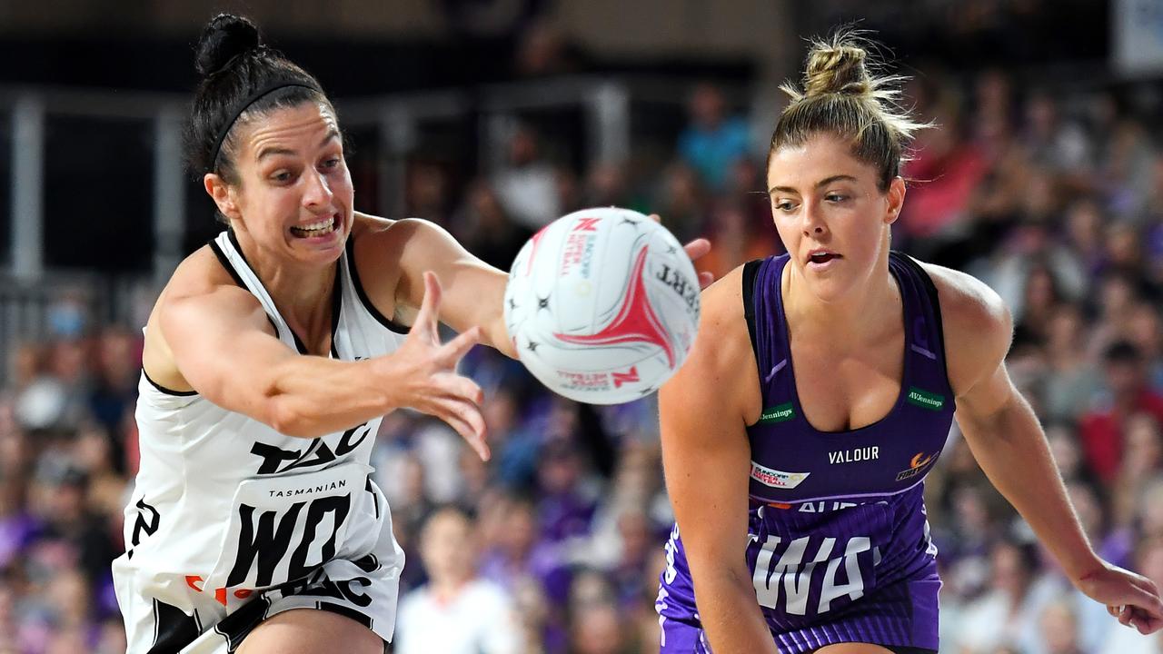 BRISBANE, AUSTRALIA - APRIL 24: Ash Brazill of the Magpies receives the ball in front of Lara Dunkley of the Firebirds during the round six Super Netball match between Queensland Firebirds and Collingwood Magpies at Nissan Arena, on April 24, 2022, in Brisbane, Australia. (Photo by Albert Perez/Getty Images)
