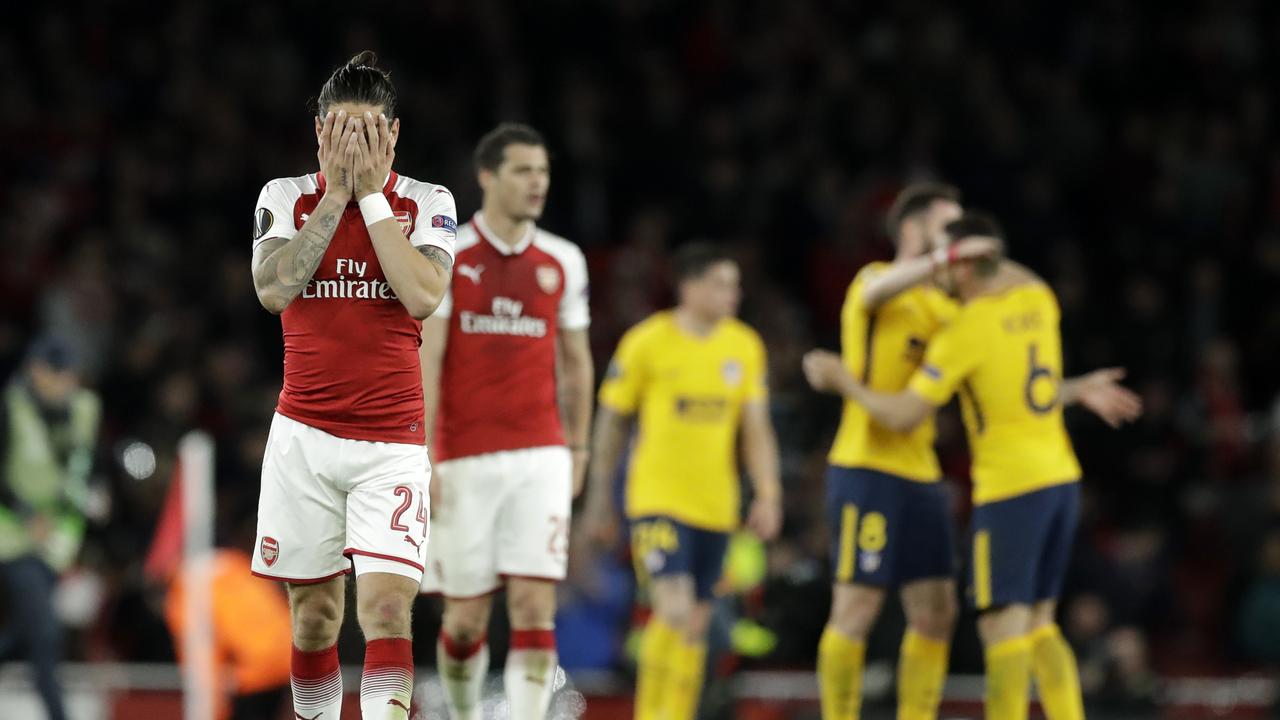 Arsenal's players react after full-time.