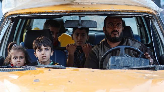 Residents of the refugee camp of Bureij arrive in Deir al-Balah in the central Gaza Strip following an Israeli evacuation order, on Friday. Picture: AFP