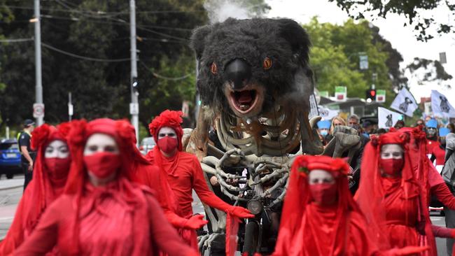 An art piece depicting a burning koala is displayed during a climate change protest in Melbourne on December 9.