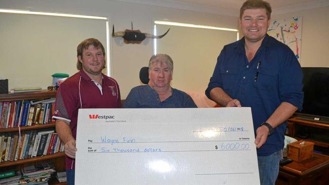 THE GIFT OF GIVING: Trent Knight and Jeff Connolly from the Red Bulls presenting Wayne Finn with $6000 raised from the Kirsten Albeck Rugby 9s memorial day. Picture: Molly Hancock