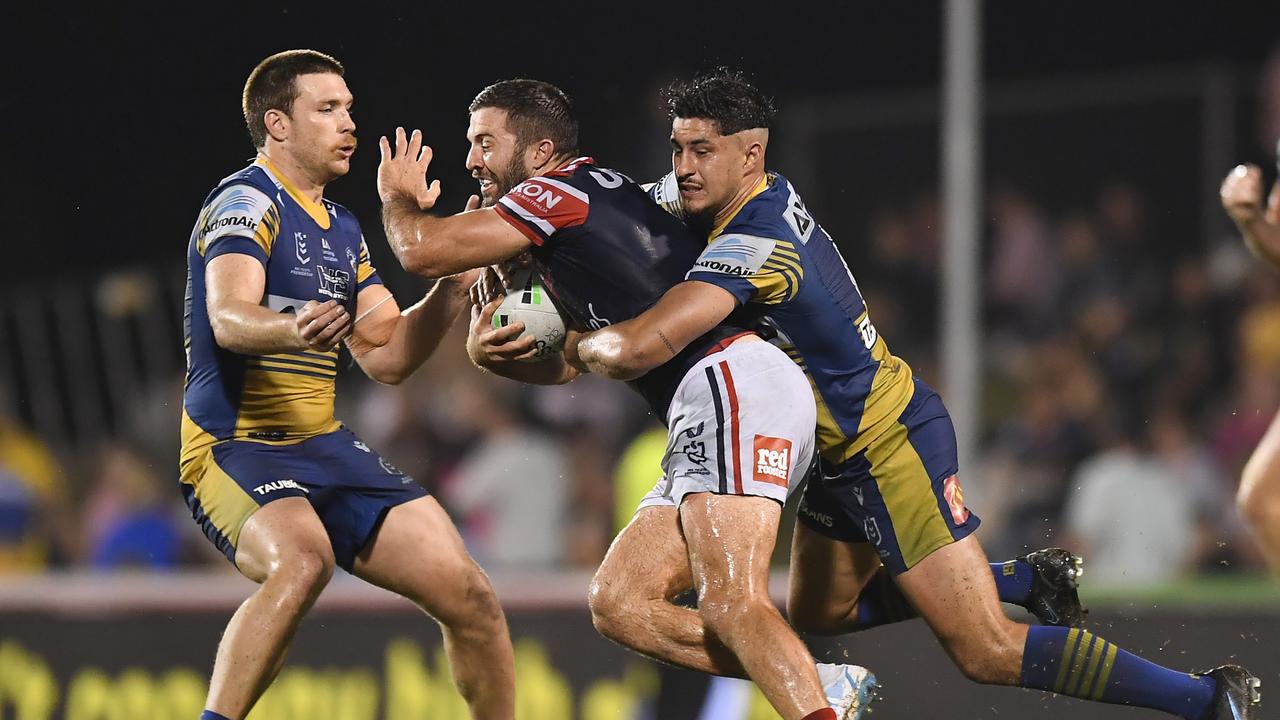 MACKAY, AUSTRALIA - JULY 29: James Tedesco of the Roosters is tackled during the round 20 NRL match between the Sydney Roosters and the Parramatta Eels at BB Print Stadium, on July 29, 2021, in Mackay, Australia. (Photo by Albert Perez/Getty Images)