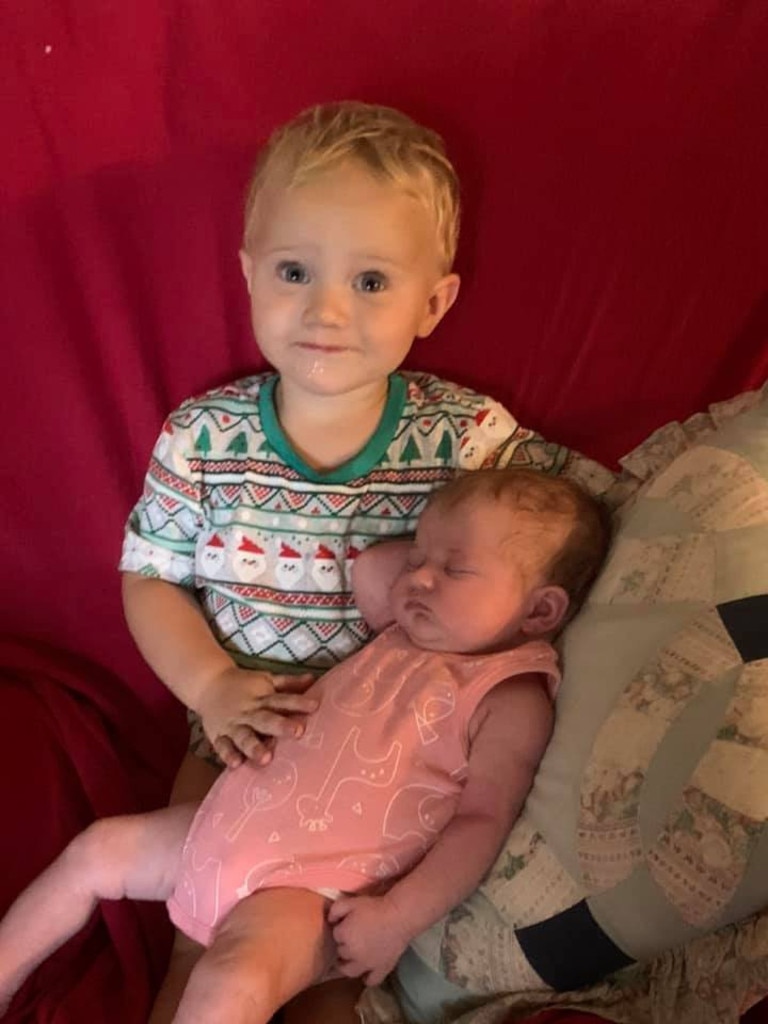 Parker Matthews with his sister Ada, celebrating her first Christmas.