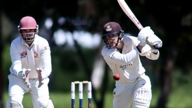 Adelaide University batter Cam Edwards plays a shot in front of Tea Tree Gully wicket keeper jack Holliday. Picture: Kelly Barnes