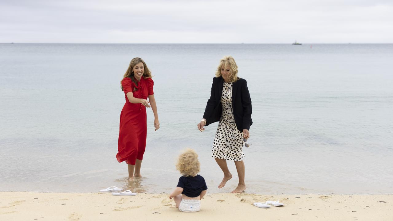 Carrie Johnson and First Lady of the United States Dr Jill Biden with Wilfred Johnson sits on the beach during the G7 leaders Summit. Picture: Simon Dawson/Downing Street/Pool/Anadolu Agency via Getty Images