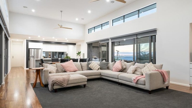 Soaring high ceilings in the hilltop suburban pad.