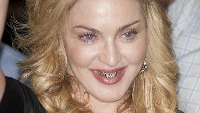Popstar Madonna showed off her gold and diamond teeth caps. back in August for the first time. Picture: Splash  
