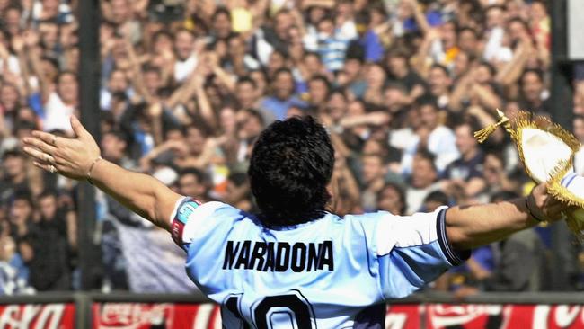 Argentinian football star Diego Maradona greets the public in the La Bombonera stadium of Boca Juniors Athletic club in Buenos Aires in 2001.