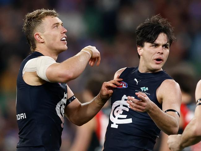 MELBOURNE, AUSTRALIA - JUNE 09: (L-R) Patrick Cripps, Elijah Hollands and Matthew Kennedy of the Blues celebrate during the 2024 AFL Round 13 match between the Essendon Bombers and the Carlton Blues at The Melbourne Cricket Ground on June 09, 2024 in Melbourne, Australia. (Photo by Michael Willson/AFL Photos via Getty Images)