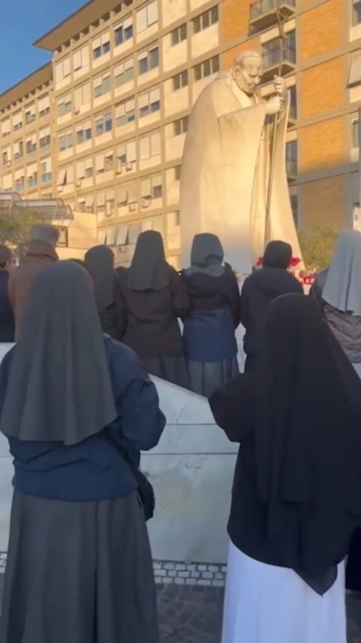 Crowds gather outside Rome’s Gemelli Hospital to pray for Pope Francis