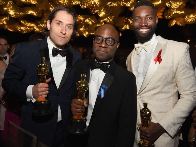 <i>Moonlight</i>’s producer Jeremy Kleiner, director Barry Jenkins and screenwriter Tarell Alvin McCraney finally celebrate after a false start. Picture: Kevork Djansezian/Getty Images/AFP