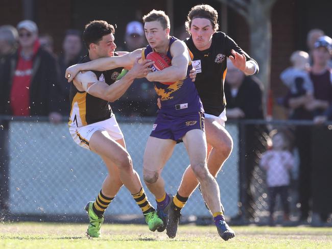 Mitch Honeychurch attempts to shrug off a tackle. Picture: David Crosling