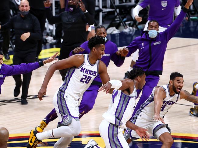 DENVER, CO - DECEMBER 23: The Sacramento Kings celebrate their last-second victory over the Denver Nuggets at Ball Arena on December 23, 2020 in Denver, Colorado. NOTE TO USER: User expressly acknowledges and agrees that, by downloading and/or using this photograph, user is consenting to the terms and conditions of the Getty Images License Agreement (Photo by Jamie Schwaberow/Getty Images)