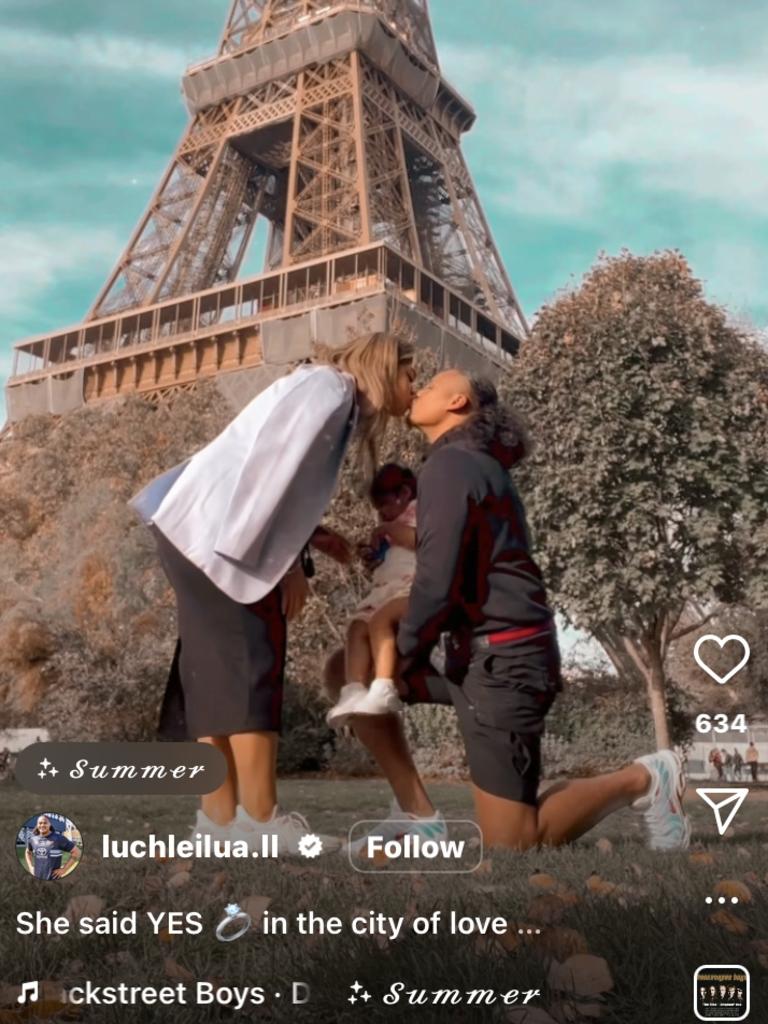 Luciano Leilua proposes in front of the Eiffel Tower.