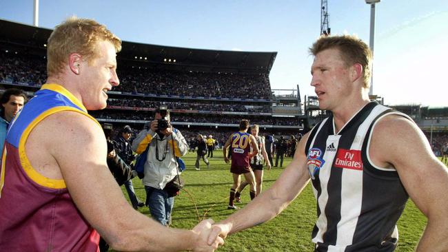 AFL Grand Final. Nathan Buckley congratulates Michael Voss. ex melb. 27/9/03 pic David Geraghty.