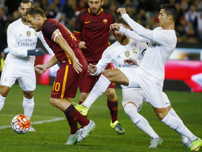 Cristiano Ronaldo tries to defend an attacking Francesco Totti.