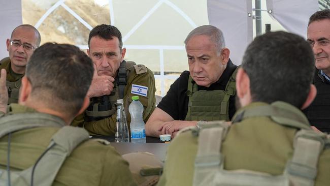 Israel's Prime Minister Benjamin Netanyahu (R), Defence Minister Israel Katz (R) and army Chief-of-Staff Herzi Halevi (2nd L) during a briefing. Picture: AFP.