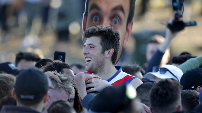 Mark Kovacevic stands head and shoulders above a crowd of West Preston supporters.