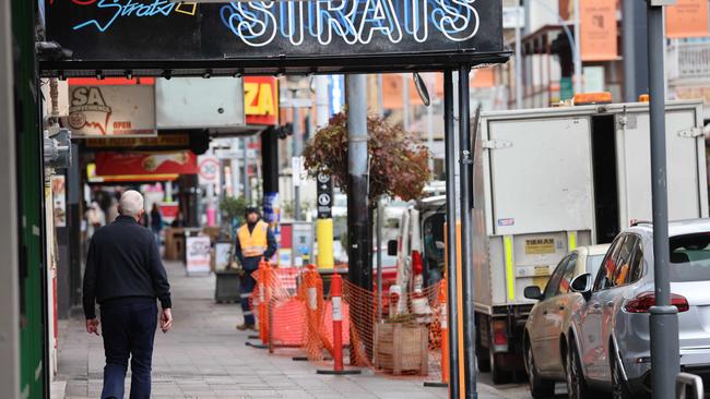 A lone pedestrian walks along Hindley St. Picture: Russell Millard