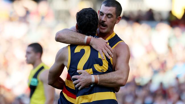 Shane McAdam and Tex Walker celebrate a goal at Adelaide Oval. Picture: AFL Photos via Getty Images