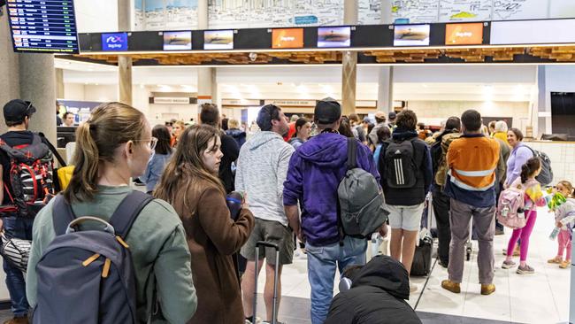 Brisbane Airport have rostered on dozens of additional staff on Monday to assist with luggage if there are any breakdowns. Picture: Richard Walker