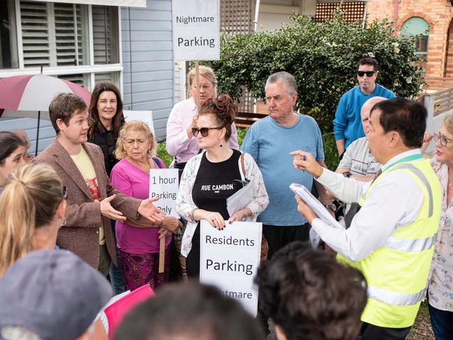 Residents in Hardie St discuss their frustrations over the lack of available parking with one of Bayside Council’s parking officers. Picture: Flavio Brancaleone