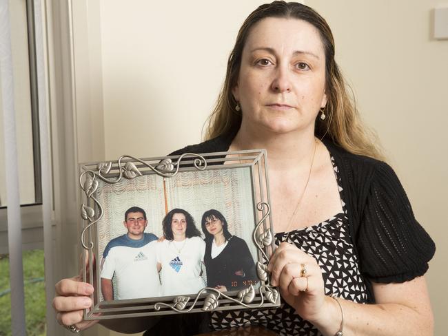 Maria Machuca holds a picture of her brother Alex who was killed in a car crash in 2004.