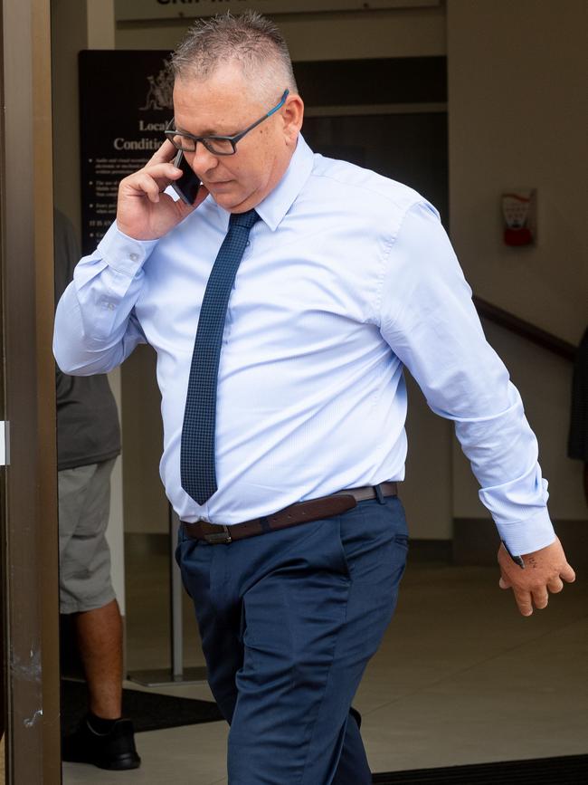 Superintendent Daniel Shean leaves the Darwin Local Court on Tuesday after his lawyer told the court an application for a DVO against him was an ‘abuse of process’.