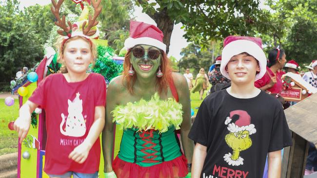 Tyler and Lily Cooper with Grinchy in the annual Christmas Pageant and Parade down the Esplanade and Knuckey Streets. Picture: Glenn Campbell