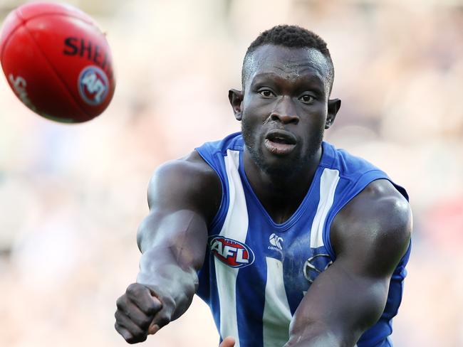 AFL Round 12. 09/06/2018.  Geelong v North Melbourne at GMHBA Stadium, Geelong.  North melbourneÕs Majak Daw clears by hand    . Pic: Michael Klein