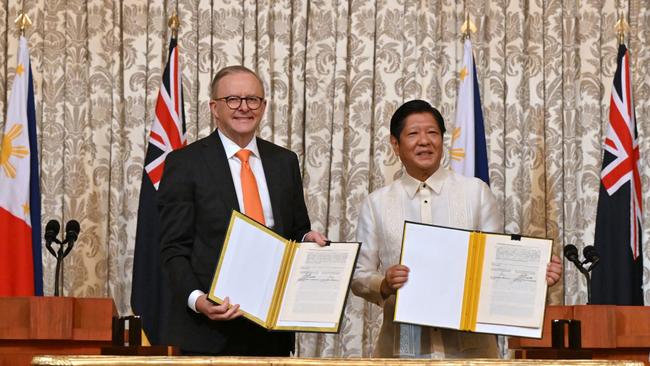 Prime Minister Anthony Albanese and Philippines President Ferdinand Marcos Jr sign a memorandum of understanding for a strategic partnership at the Malacanang Presidential Palace in Manila in September. Picture: AAP