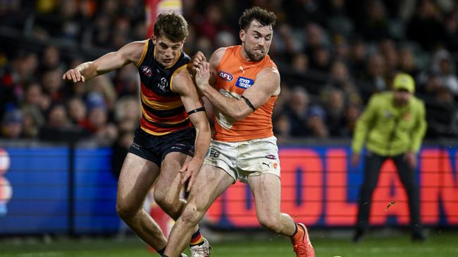 ADELAIDE, AUSTRALIA - JUNE 29: Brent Daniels of the Giants competes with Billy Dowling of the Crows during the round 16 AFL match between Adelaide Crows and Greater Western Sydney Giants at Adelaide Oval, on June 29, 2024, in Adelaide, Australia. (Photo by Mark Brake/Getty Images)