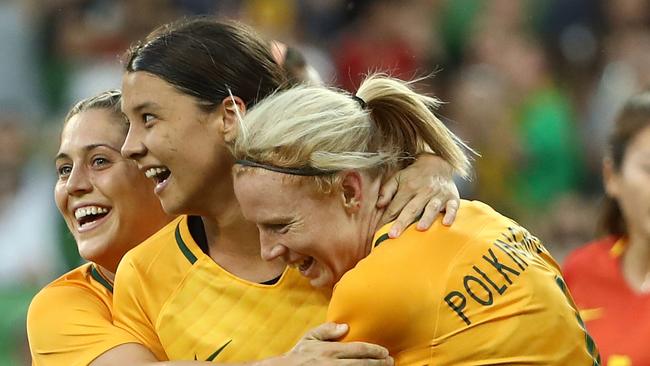 Matildas star Sam Kerr (centre) celebrates scoring against China on Wednesday night.