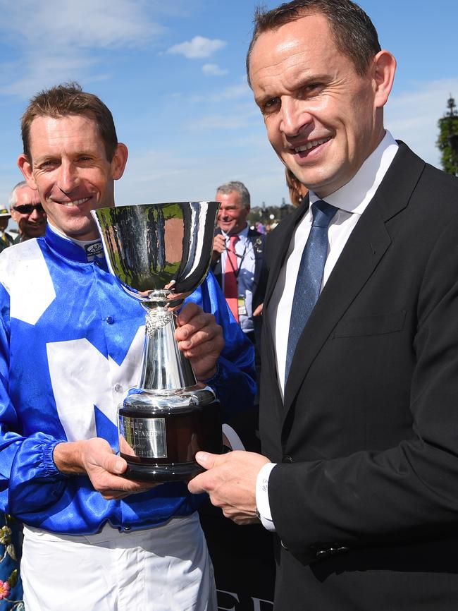 Trainer Chris Waller and Hugh Bowman with the Turnbull Stakes trophy. Picture: Getty Images