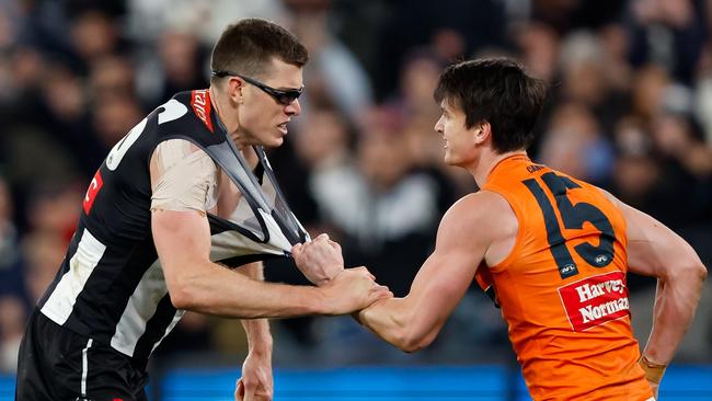 MELBOURNE, AUSTRALIA - SEPTEMBER 22: Mason Cox of the Magpies engages with Sam Taylor of the Giants after a goal during the 2023 AFL First Preliminary Final match between the Collingwood Magpies and the GWS GIANTS at Melbourne Cricket Ground on September 22, 2023 in Melbourne, Australia. (Photo by Dylan Burns/AFL Photos via Getty Images)