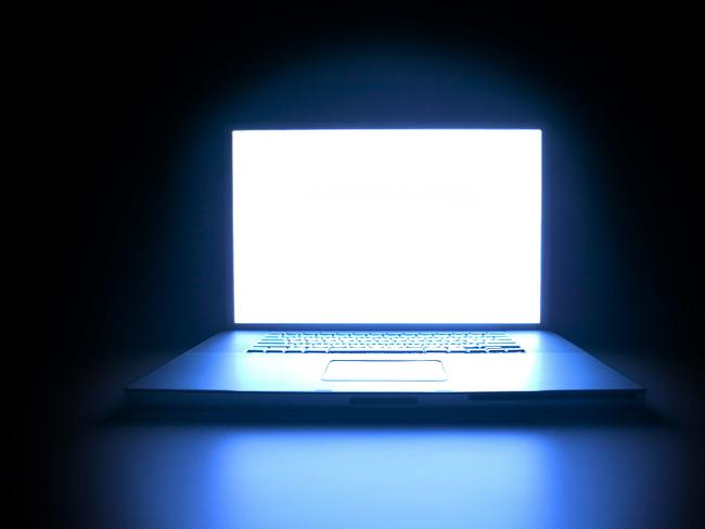 Generic shot of a laptop computer as the screen glows in the darkness. Picture: Image Thinkstock