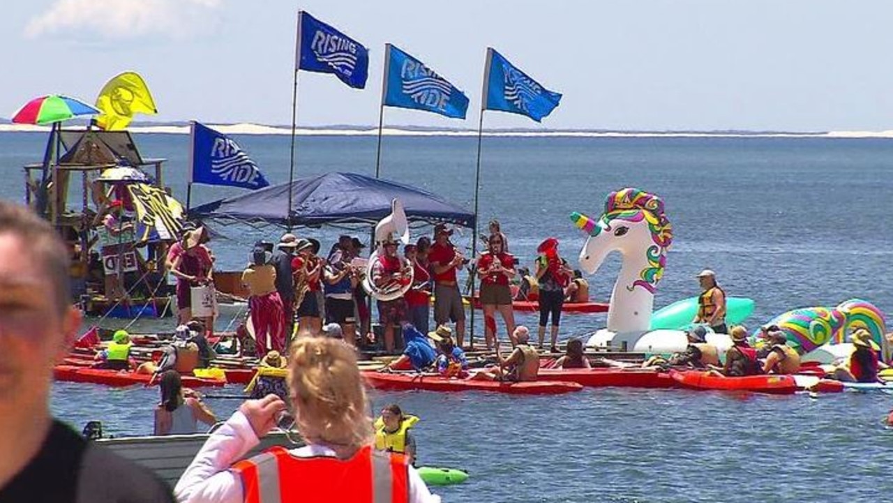 The activists had permission for a 30-hour protest at the world's largest coal port but when they refused to leave at 4pm on Sunday, police moved in. (Picture: Nine)