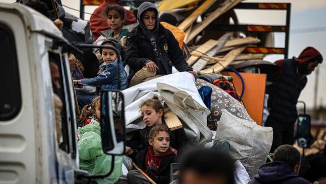 Palestinians flee Khan Yunis in the southern Gaza Strip on January 26 amid ongoing battles between Israel and Hamas. Picture: AFP