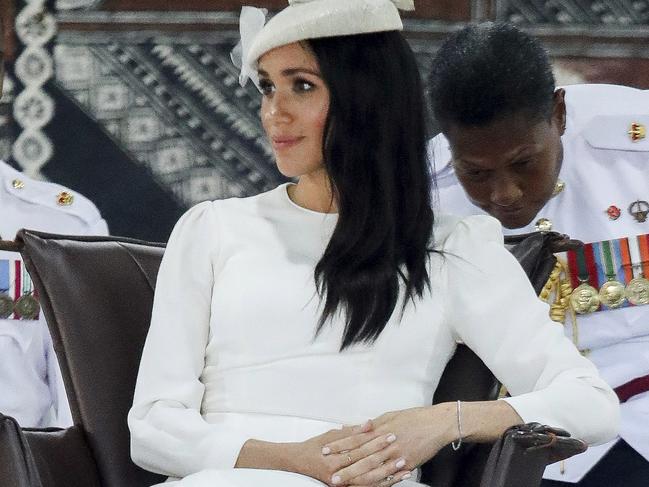 The guy behind her seems to be trying to take a closer look at said bracelet. Picture: Chris Jackson/Pool Photo via AP