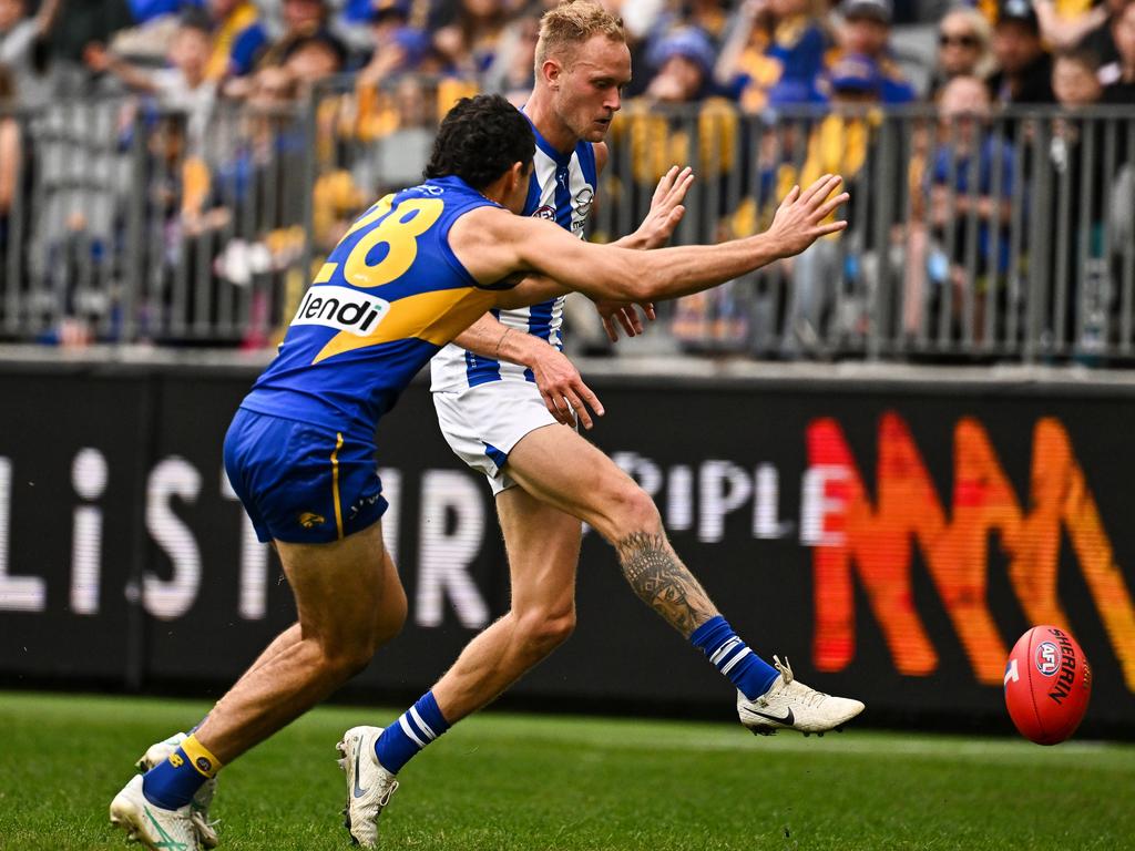 Jaidyn Stephenson dribbles through a goal for North Melbourne. Picture: Daniel Carson/AFL Photos via Getty Images