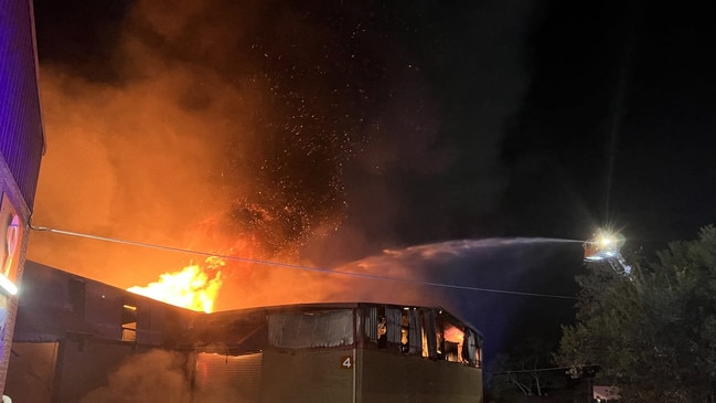 A warehouse fire which is expected to burn “for days” is being treated by police as suspicious. Picture: FRNSW