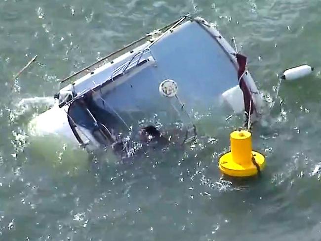 The capsized vessel off Manly. Picture: 9 News