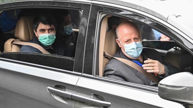 Peter Daszak, right, Vladimir G. Dedkov, left, and other members of the World Health Organisation (WHO) team investigating the origins of the Covid-19 coronavirus, leave the Hubei Center for animal disease control and prevention in Wuhan. Picture: AFP