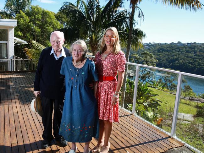 NORTH SHORE TIMES /AAP.Dr Frank Fisher and Penelope Fisher with their daughter Sarah Fisher at their former home in Castlecrag which they are selling after more than 50 years.Thursday 25th April, 2019 The home is a beautiful Modernist design and one of the area's landmark properties. It is expected to sell for more than $6 million. (AAP IMAGE / MARK SCOTT)