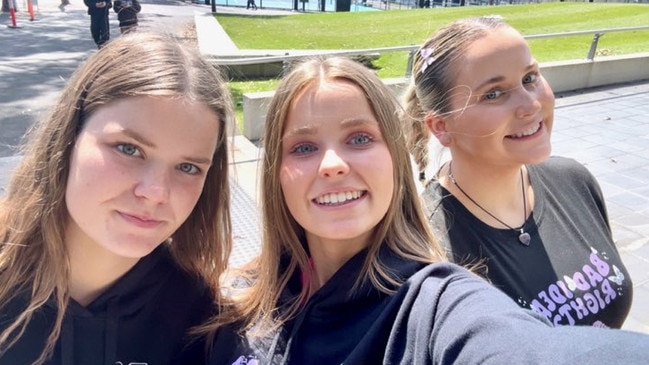 Sisters Emily, Chloe, and Imogen McAloon before the show in Melbourne.