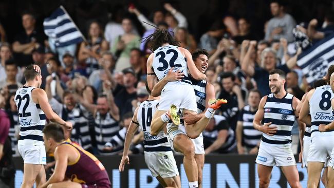 Tom Hawkins and Gryan Miers of the Cats celebrate their preliminary final win over the Lions on Saturday. Picture: Getty Images