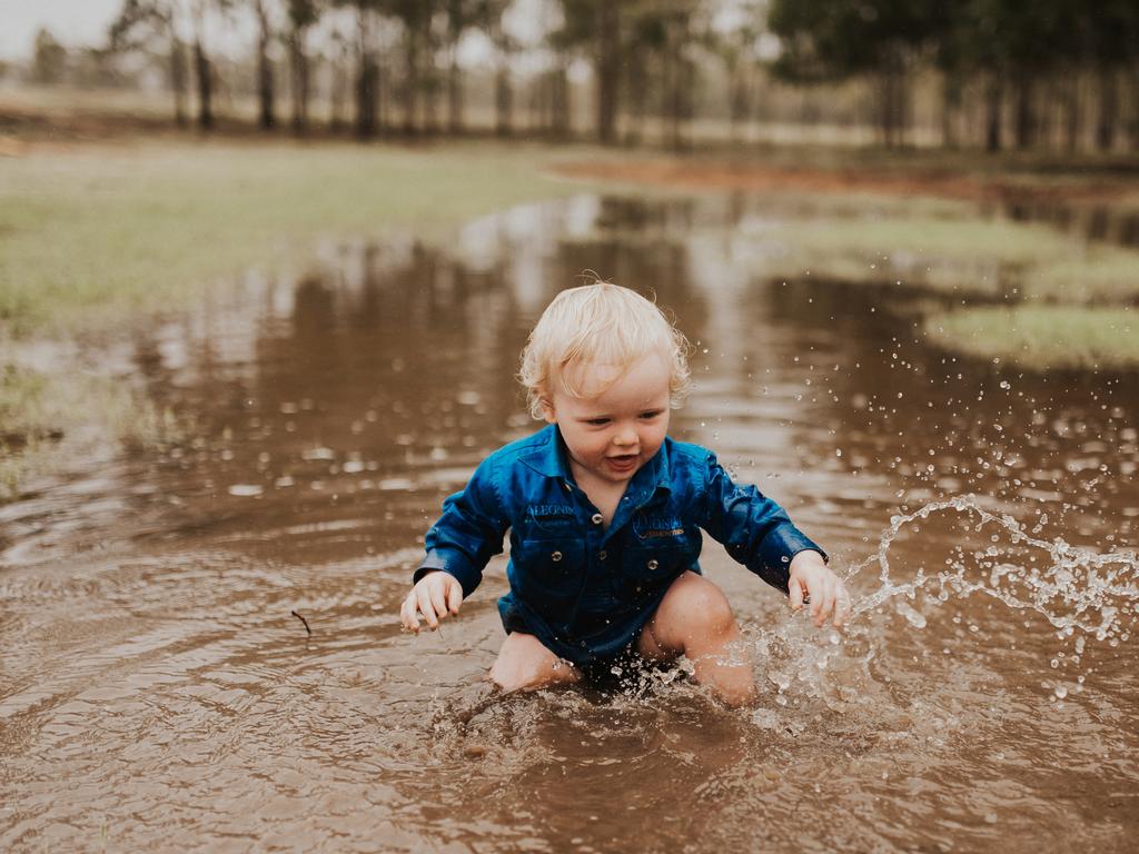 Hayes Pugh playing in puddles at Springview Station, Mingela. Picture: Vicki Miller