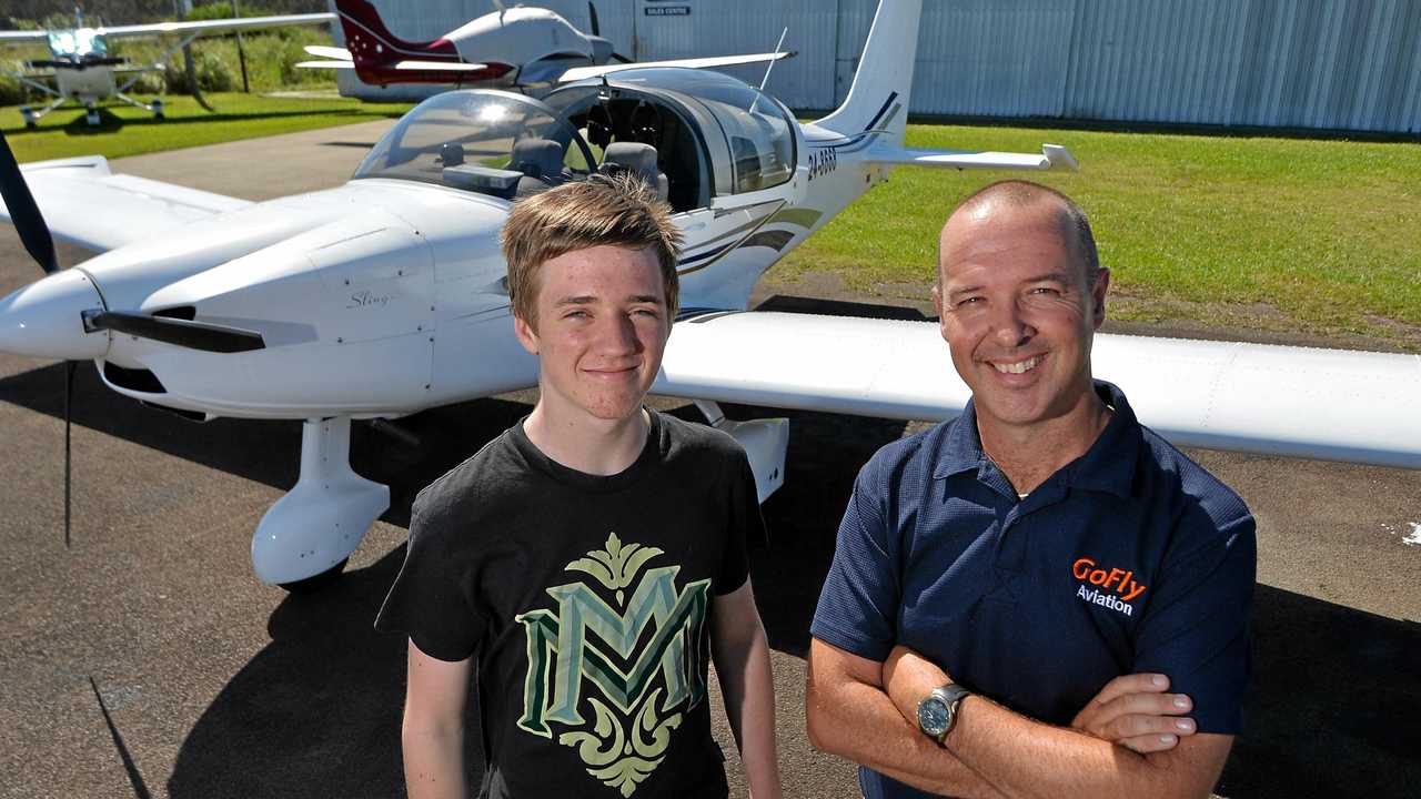 WINGS: Adain Harris, 15, has won a learn to fly scholarship offered up by GoFly Aviation. Chief Pilot and owner Damian Wills congratulates Adain. Picture: Patrick Woods