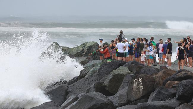 Thousands of people are out and about to watch the swell at Kirra as Cyclone Alfred sits off the coast. Pics Adam Head